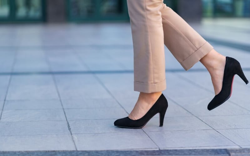 woman wearing classic black high heel toe shoes