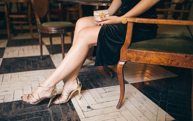 a woman in strappy heels