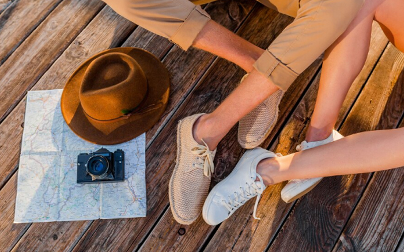 a couple wearing different types of shoes