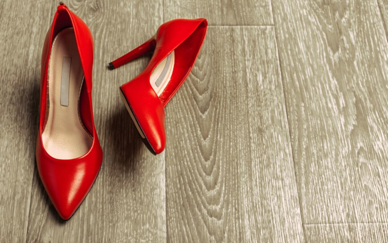 a pair of red-bottomed shoes