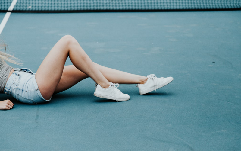 a woman wearing sneakers